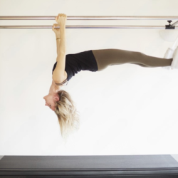 5 Essential Pilates Exercises to Try on a Trapeze Table